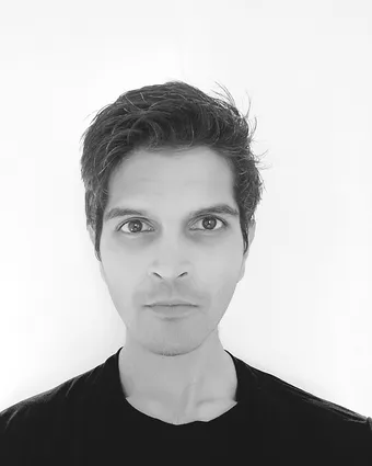 Harivansh, photographed in black and white against a plain background.
